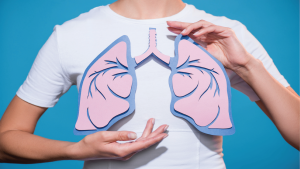 woman holding cardboard lungs