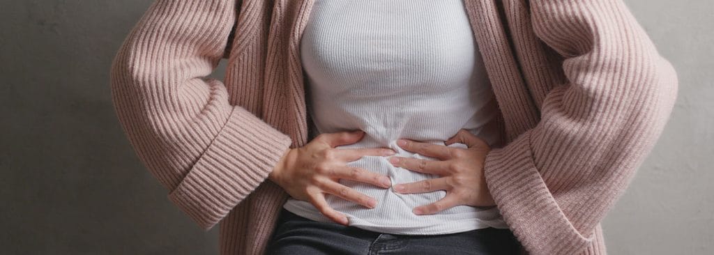 lady suffers from stomach gurgling